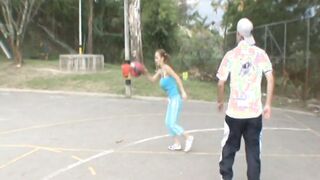 Paris Milan plays basketball outdoors