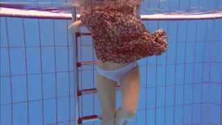 Redhead Katka playing underwater