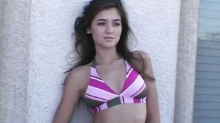 Stripping teen girl takes off her bikini