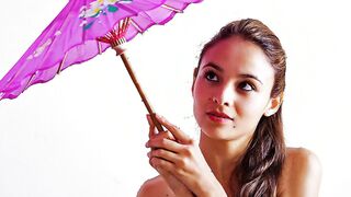 Fedra toying her snatch with a purple parasol
