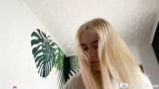 Blonde babe is on her knees & giving a blowjob