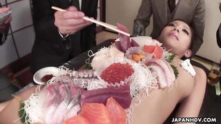 Sucking on the assistant's nipples