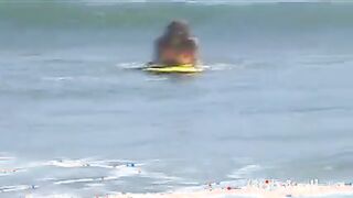 Little April Playing in the Beach